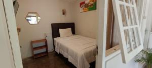 Ein Bett oder Betten in einem Zimmer der Unterkunft The Bloomy House