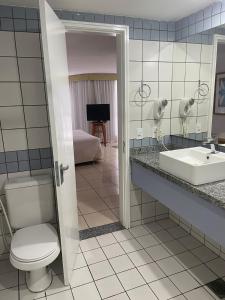 Koupelna v ubytování IATE PLAZA HOTEL Calçadão Frente Mar 603