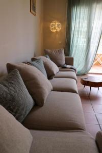 a row of pillows on a couch in a living room at SATUNA BEACH CASA in Begur