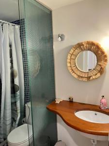 a bathroom with a sink and a mirror at SATUNA BEACH CASA in Begur