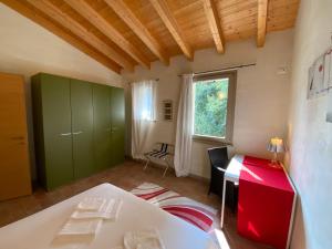 Postel nebo postele na pokoji v ubytování L'Isolo b&b e case vacanza