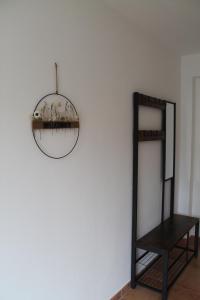 un espejo colgado en una pared junto a un estante en Ferienwohnung in Ruppichteroth Winterscheid en Ruppichteroth