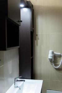 Koupelna v ubytování Pasiphae Lux Apartment Downtown + 12 fotografií