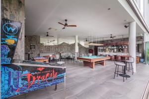 a room with a ping pong table and a pool table at Enjoy boutique in Siem Reap