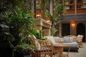 a group of chairs and a couch on a patio at Palma Riad - Adults Only in Palma de Mallorca +165 photos