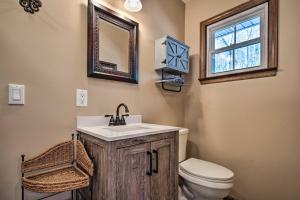 a bathroom with a sink and a toilet and a window at Pet-Friendly Saluda Home with Mountain Views! in Saluda +21 photos