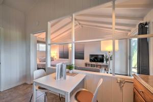 a room with a table and chairs and a bedroom at Santa Barbara Studio Near Downtown and Beaches in Santa Barbara