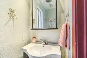 a bathroom with a sink and a mirror at Pet-Friendly Austin Home with Private Hot Tub! in Austin +31 photos