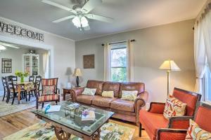 a living room with a couch and a table at Georgetown Vacation Rental Close to Town Square! in Georgetown