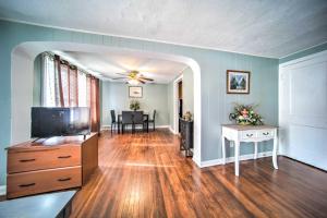 a living room with a television and a dining room at Eastlake Vacation Rental Near Lake Erie! in Eastlake