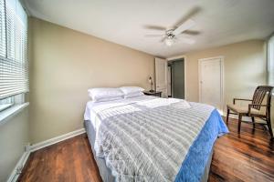 a bedroom with a bed and a ceiling fan at Eastlake Vacation Rental Near Lake Erie! in Eastlake