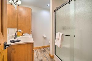 a bathroom with a sink and a glass shower at Pateros Home with Deck, 7 Mi to Alta Lake Park! in Brewster +37 photos