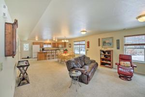 a living room with a couch and a table at Pet-Friendly Montana Getaway Near Kayaking! in Missoula