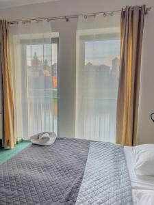Postel nebo postele na pokoji v ubytování Hotel Poleski