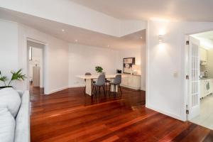 a white living room with a table and chairs at Setubal Downtown N97, By Home Match in Setúbal