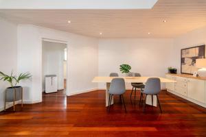 a dining room with a table and chairs at Setubal Downtown N97, By Home Match in Setúbal +16 photos