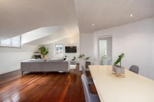 a living room with a couch and a table at Setubal Downtown N97, By Home Match in Setúbal