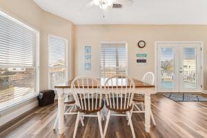 a dining room with a table and chairs at Beach Haven by Meyer Vacation Rentals in Gulf Shores