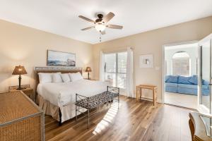 a bedroom with a bed and a ceiling fan at Beach Haven by Meyer Vacation Rentals in Gulf Shores