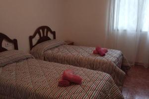 A bed or beds in a room at Casa Agner