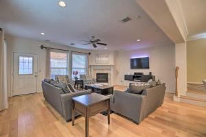 a living room with two couches and a fireplace at 2,500 Sq Ft Townhome - Walk to Central River Oaks! in Houston