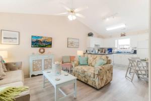 a living room with a couch and a table at The Hairy Crab in Oak Island