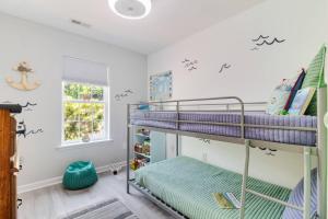 a bedroom with two bunk beds in a room at The Hairy Crab in Oak Island