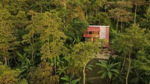an aerial view of a house in the middle of a forest at Monte La MaMa Ecolodge in Viotá