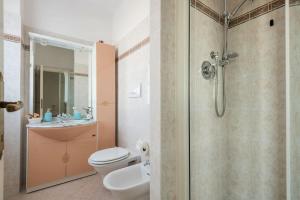 a bathroom with a shower and a toilet and a sink at Fiesole is Magic in Fiesole +44 photos