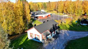 an aerial view of a house in the woods at Pitkämö Canyon Camping Oy in Kurikka