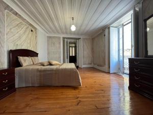 Cama ou camas em um quarto em Alojamento VINTAGE BAIXA - TOMAR