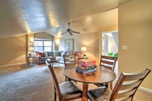 a living room with a table and chairs at Stocked Grand Junction Home at Canyon View Park! in Grand Junction