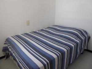 A bed or beds in a room at Appartement lumineux sur les canaux