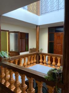 a room with a balcony with a wooden railing at House Naïma in Rabat