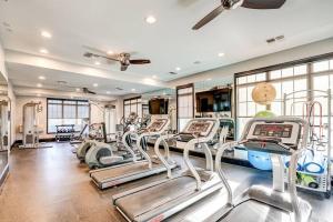 a gym with treadmills and elliptical machines at Garden Styles Herndon Dulles Airport in Herndon
