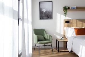 Łóżko lub łóżka w pokoju w obiekcie Be Casa - Rivas