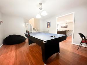 a living room with a pool table in it at Cute 2-BRM Walkout apt with pool table and theater in Lexington