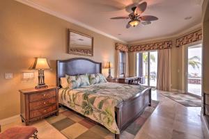a bedroom with a bed and a ceiling fan at Riverfront Titusville Home with Pool and Pickleball! in Titusville +36 photos