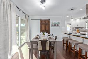 a dining room and kitchen with a table and chairs at Manhatton Tempe home in Tempe