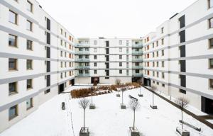 an empty courtyard in an apartment building at Metro Bemowo Colourful Apartment in Warsaw