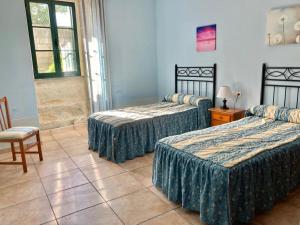 Posteľ alebo postele v izbe v ubytovaní Casa do Campo Louro