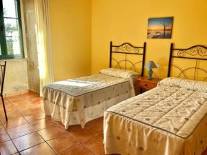 Posteľ alebo postele v izbe v ubytovaní Casa do Campo Louro