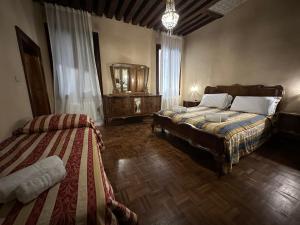 Una cama o camas en una habitación de 1 Ramo Grimani