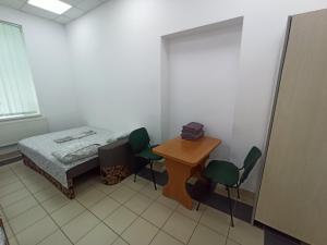 Postel nebo postele na pokoji v ubytování Старий Дворик,кімнати біля жд вокзалу