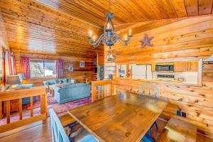 a dining room and living room with a large wooden table at Ford Family Escape in Truckee