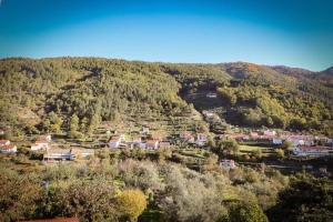 a small town in the middle of a mountain at Casa Fundo de Vila in Manteigas