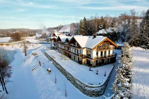 an aerial view of a house in the snow at Rezidence KUPEC in Frymburk