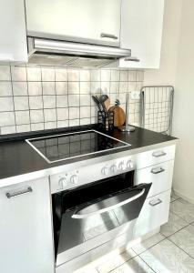 a kitchen with a sink and a stove top oven at Eindrucksvolles Gruppen– und Monteursloft in Edingen-Neckarhausen