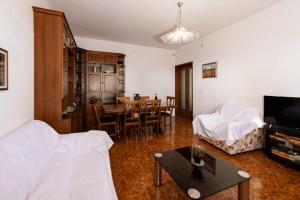 a living room with a bed and a dining room at [Volterra] Relax Apartament W/ Beautiful View in Casa al Vento