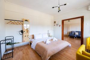 a bedroom with a bed and a living room at Venus in Thessaloniki